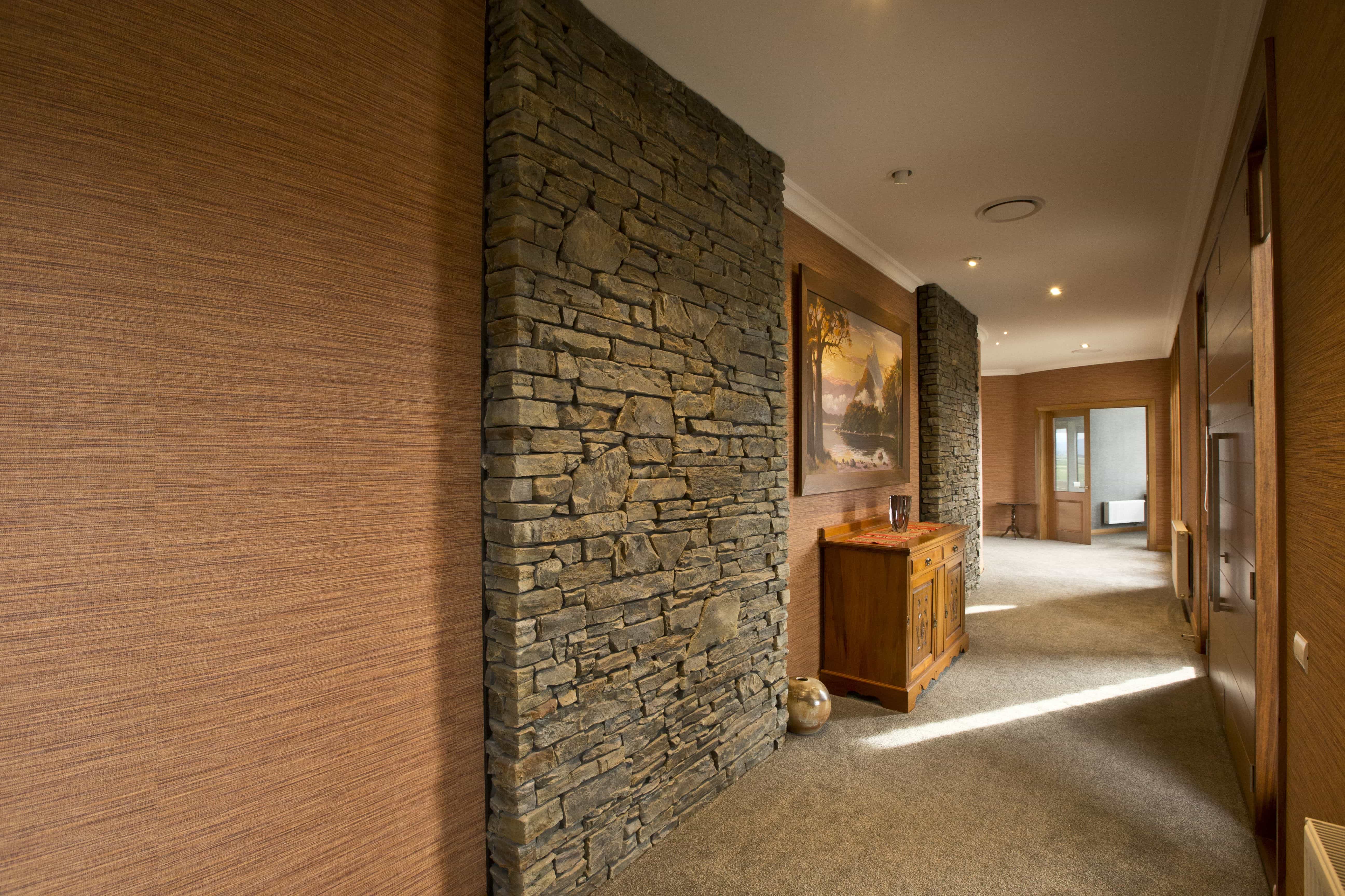  Texture is the key here with the stone work and wallpaper blending together