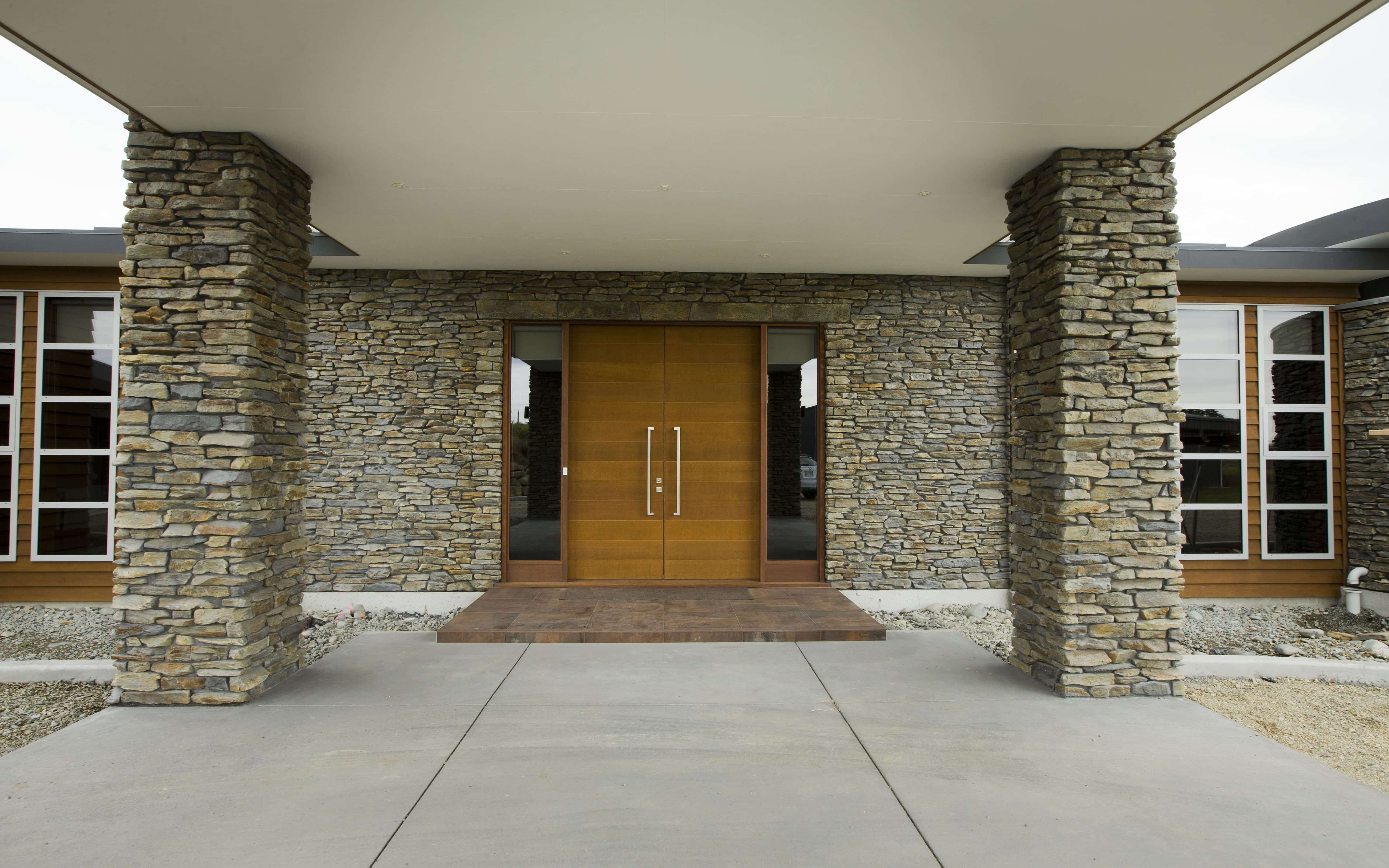  The is a spectacular grand entrance with hand crafted stone work and wooden door