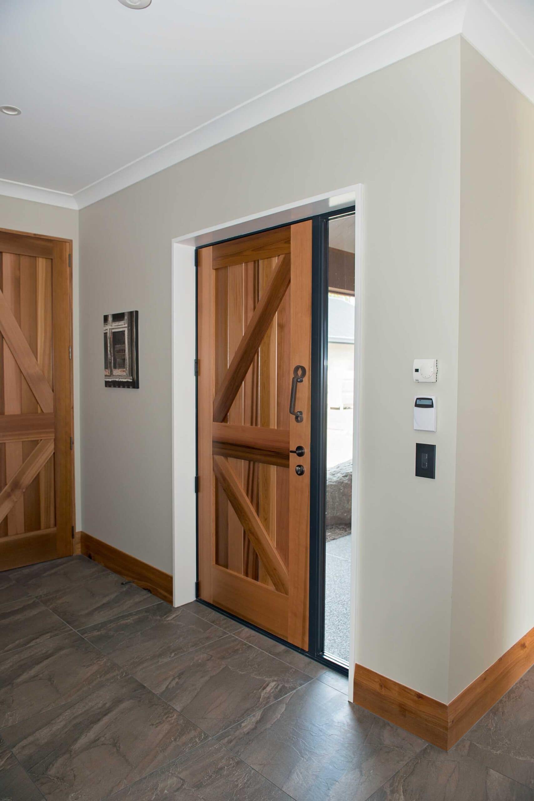  These external doors were made with recycled timber and farm implements for the door handles