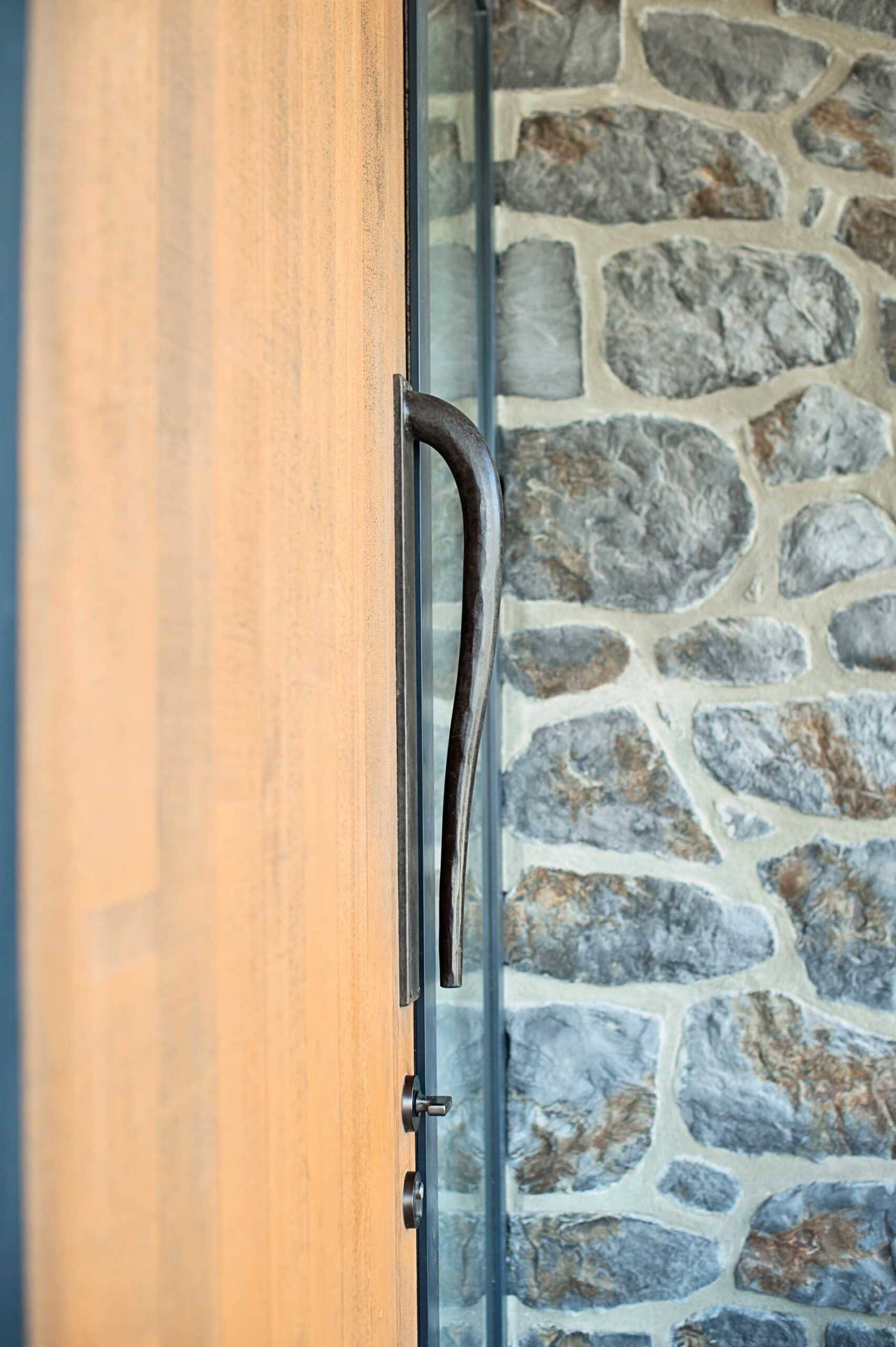  These hand forged handles were made by Tasman Forge for the front doors