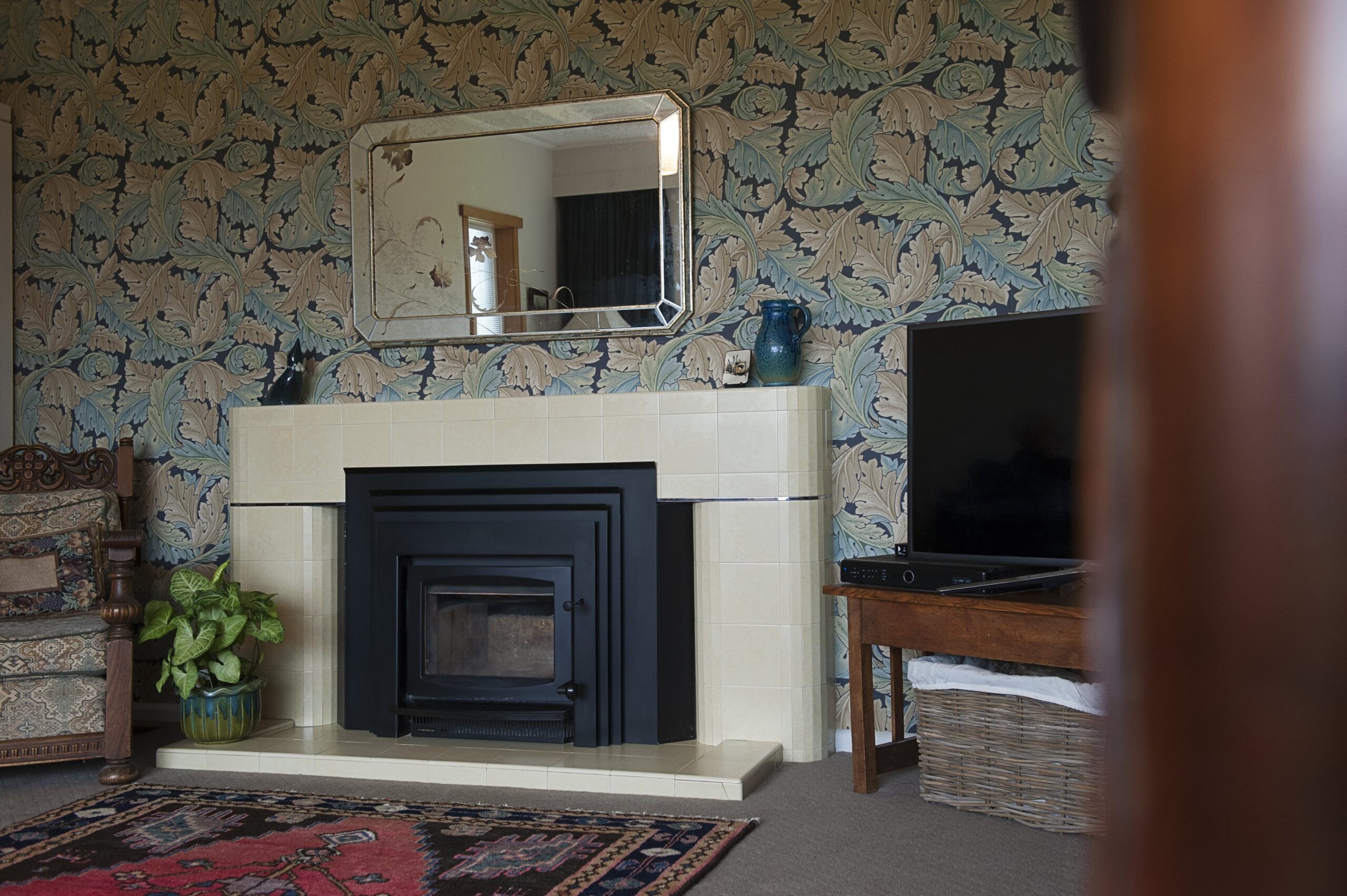  Lounge with William Morris feature wallpaper and Art Deco fireplace