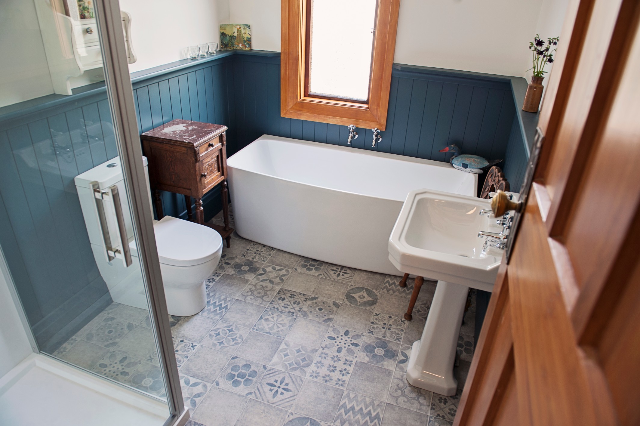  This remodeled bathroom, has "tile look" vinyl to add authenticity.