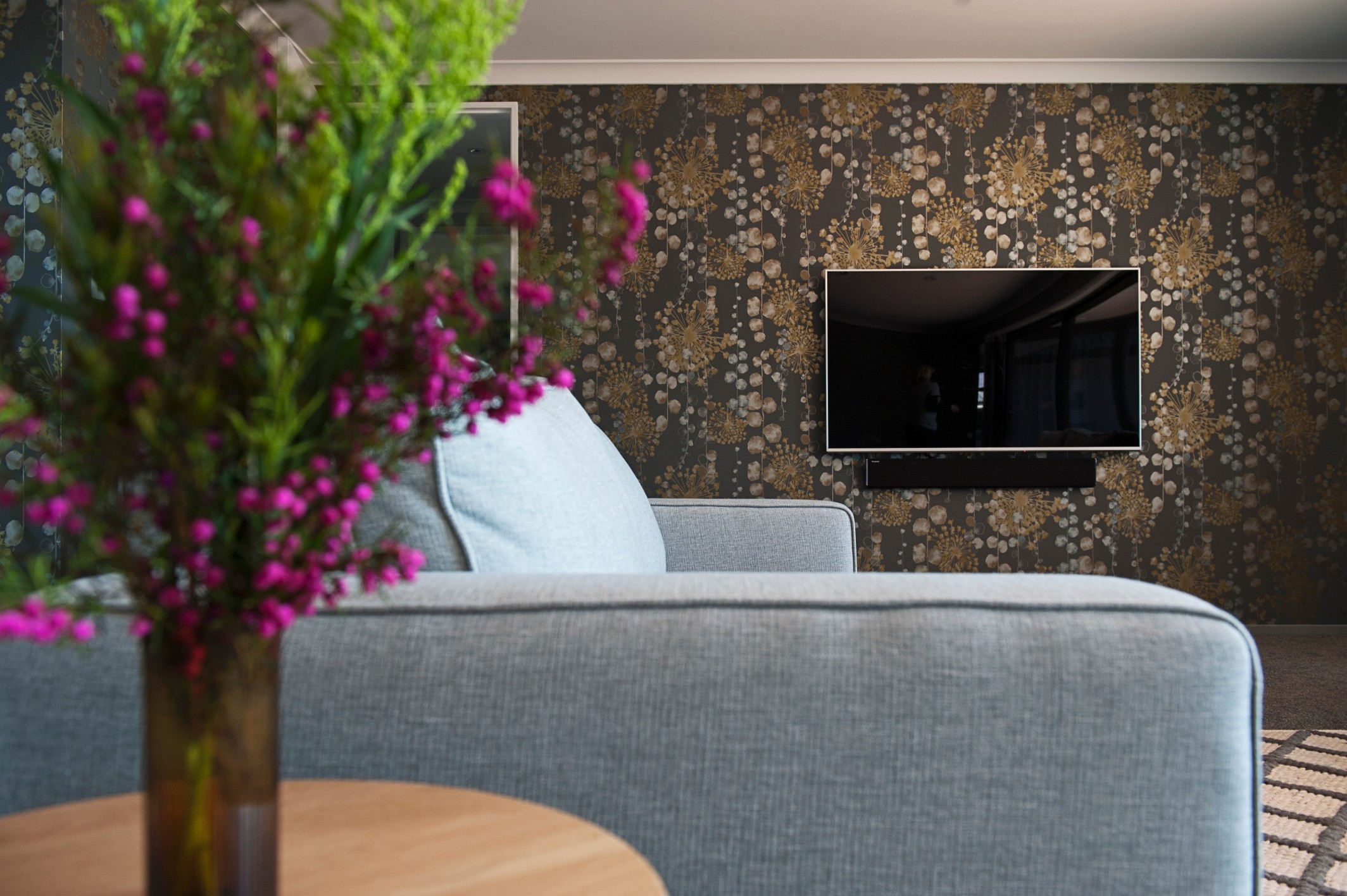  Feature Harlequin wallpaper add a splash of interest to this media room