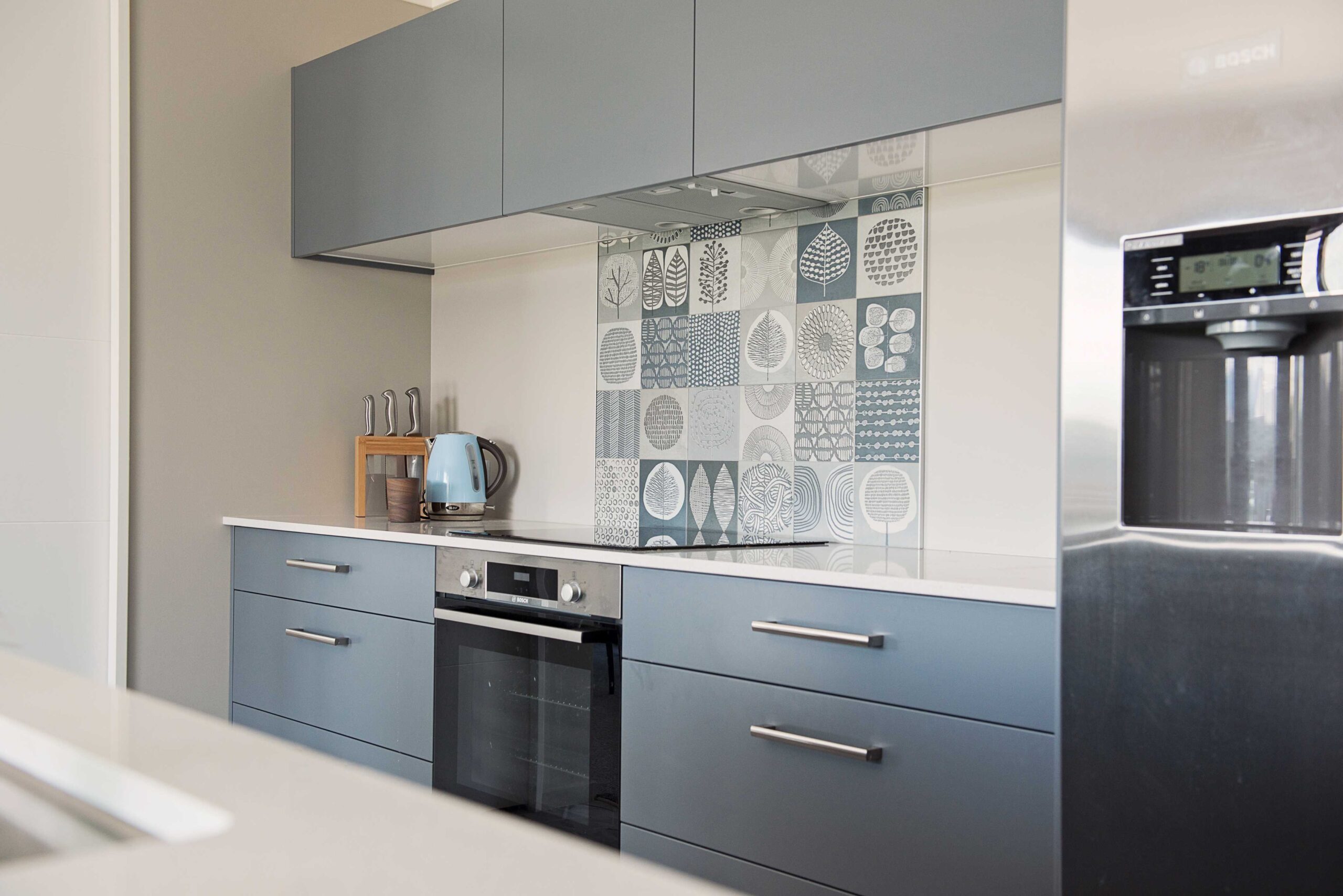  Beautiful Mid-Century tiles provide a touch of interest in this kitchen.